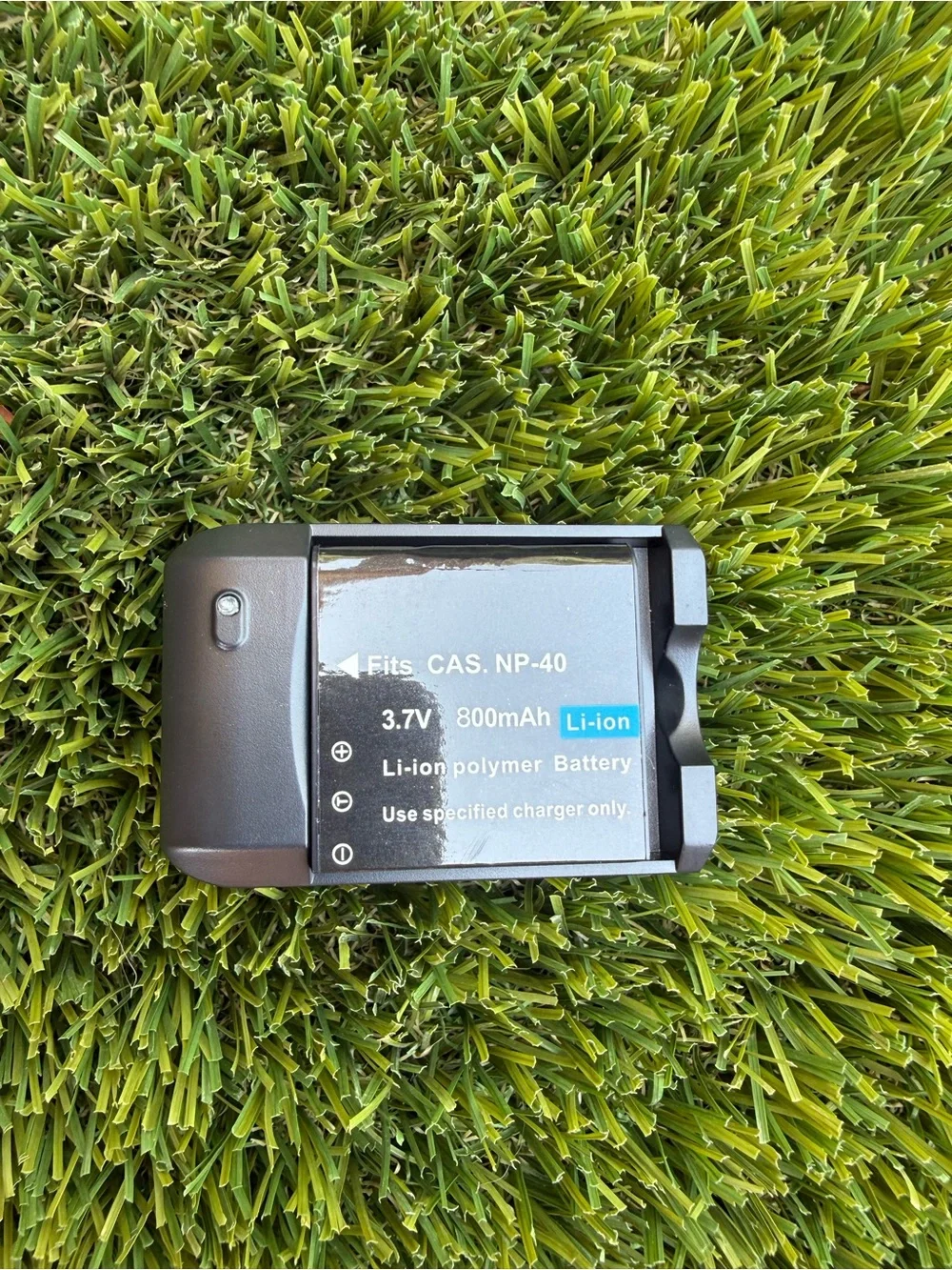 Compact Black Digital Camera with Accessories and Lens Cap